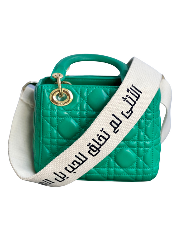 - الأنثى لم تخلق للحب بل الحب خلق لها - Arabic Writing Embroidered Strap